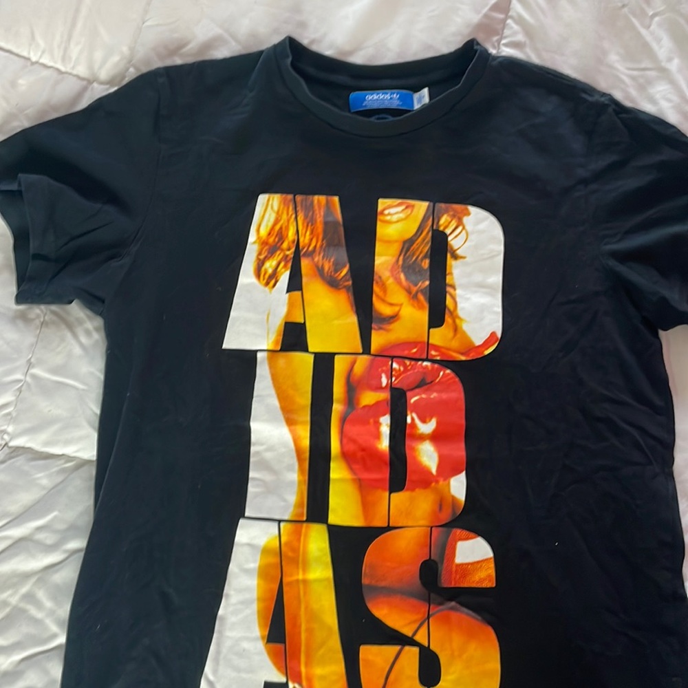 Adidas men’s black T-shirt, with a model wearing boxing gloves depicted on shirt